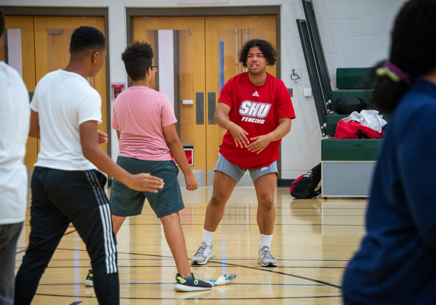 Sacred Heart University’s NCAA Division I fencing team has embarked on a collaboration with The Willie and Sandra McBride Foundation, which has started a fencing program for middle school students in Bridgeport. The team worked with children at the Fairchild Wheeler Interdistrict Magnet School during a recent training session. Sacred Heart University photo by Tracy Deer-Mirek 10/6/22